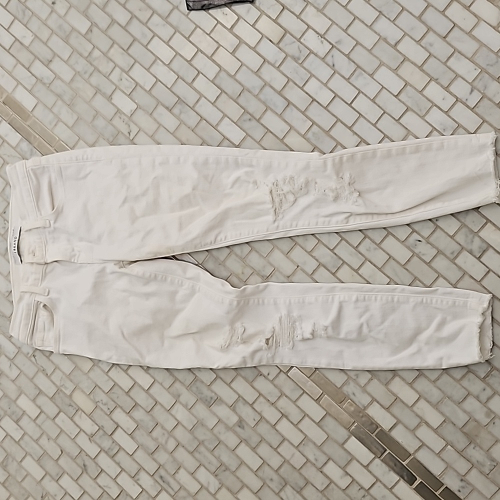 White distressed cut out jeans